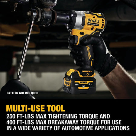 Action shot of the DEWALT DCF901B cordless impact wrench breaking loose a stubborn suspension bolt, with a text overlay noting its high-torque multi-use capabilities.