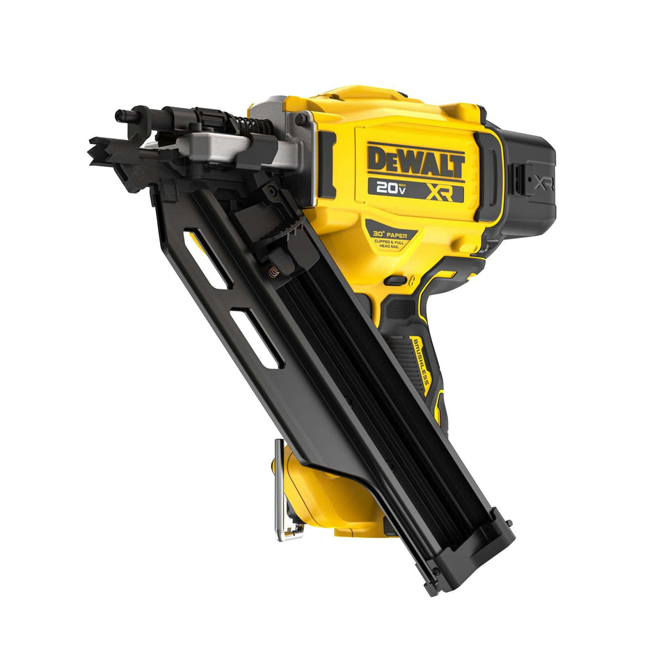 A front three-quarter studio view of the DEWALT DCN930B 20V MAX brushless cordless 30-degree paper tape framing nailer bare tool on a white background, highlighting its yellow and black motor housing, high-grip toe-nailing nose configuration, and empty black magazine channel.
