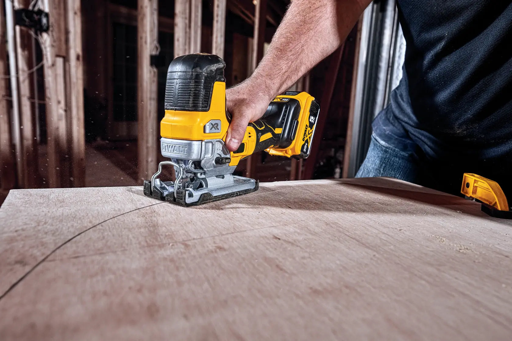 Close-up of the adjustable keyless shoe on the DEWALT DCS335B jig saw, showcasing bevel detents at 0, 15, 30, and 45 degrees for accurate angled woodworking cuts.
