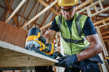 Professional woodworker using the DEWALT 20V MAX XR brushless barrel grip jig saw to perform a precise curved cut in a wooden board, highlighting the tool's maneuverability.
