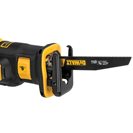 Close-up of the DEWALT 2X Long Life general purpose reciprocating saw blade installed in the tool, demonstrating the 4-position clamp capability for customized cutting angles and improved access.