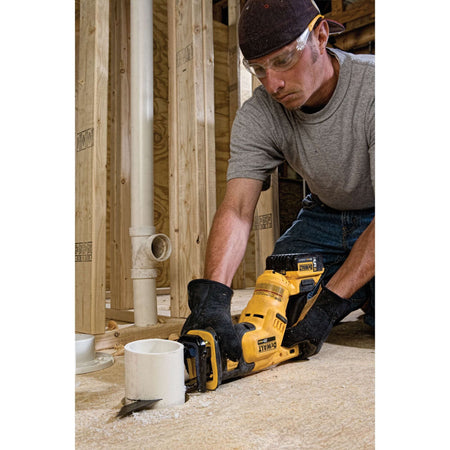 Man using a power tool in a construction setting