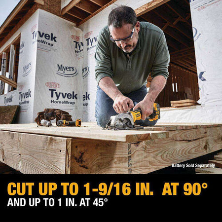 Professional contractor using the DEWALT ATOMIC 4-1/2 inch saw for flooring installation, illustrating the tool's maximum cut depth of 1-9/16 inches at 90 degrees and 1 inch at 45 degrees.