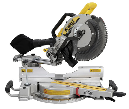 Front-facing view of the DEWALT 20V MAX brushless miter saw showcasing the wide base extensions, tall sliding fences, and the 12 inch blade equipped with a transparent safety guard.
