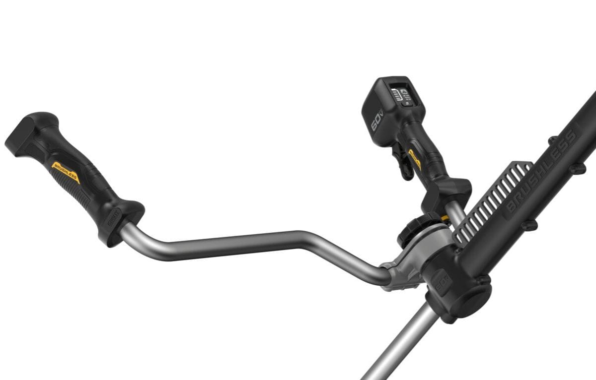 Detail shot of the ergonomic bike handle controls on the DEWALT DCST981B, featuring a textured grip, safety lock-out, and a variable speed trigger for precise landscaping control.