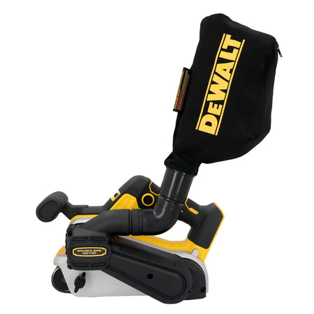 A studio profile view of the DEWALT 20V MAX XR brushless 3x21-inch cordless belt sander. The tool is shown with its professional black and yellow dust collection bag attached to the swivel AirLock port, emphasizing the integrated material removal system.