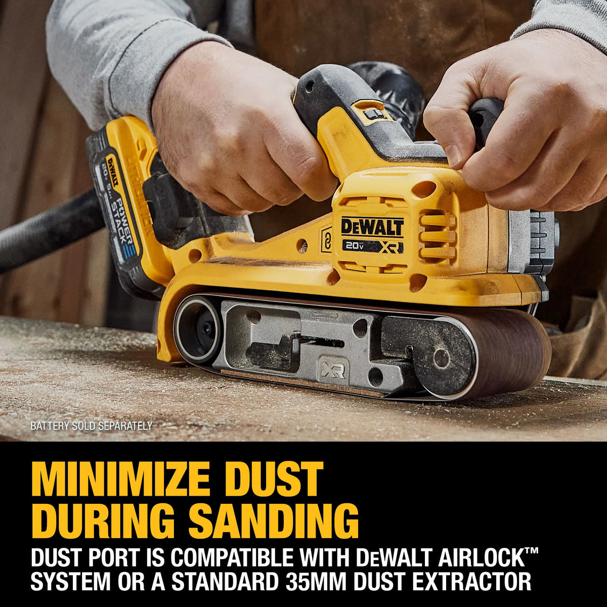 Action shot demonstrating the dust management system on the DCW222B belt sander. A technician is shown using the tool with a POWERSTACK battery and an attached vacuum hose, with text stating the dust port is compatible with the DEWALT AirLock system or standard 35mm extractors.