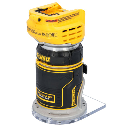 A rear three-quarter studio perspective of the DEWALT brushless compact router, detailing the yellow battery dock interface, motor housing specification decals, and the prominent black text reading Brushless Motor.