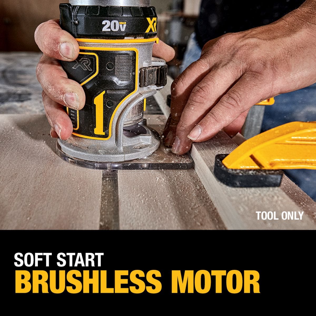 An action image of a woodworker's hand steering the cordless compact router along a thick walnut board edge to cut a straight groove channel. A lower black graphic banner calls attention to the electronic soft start brushless motor.