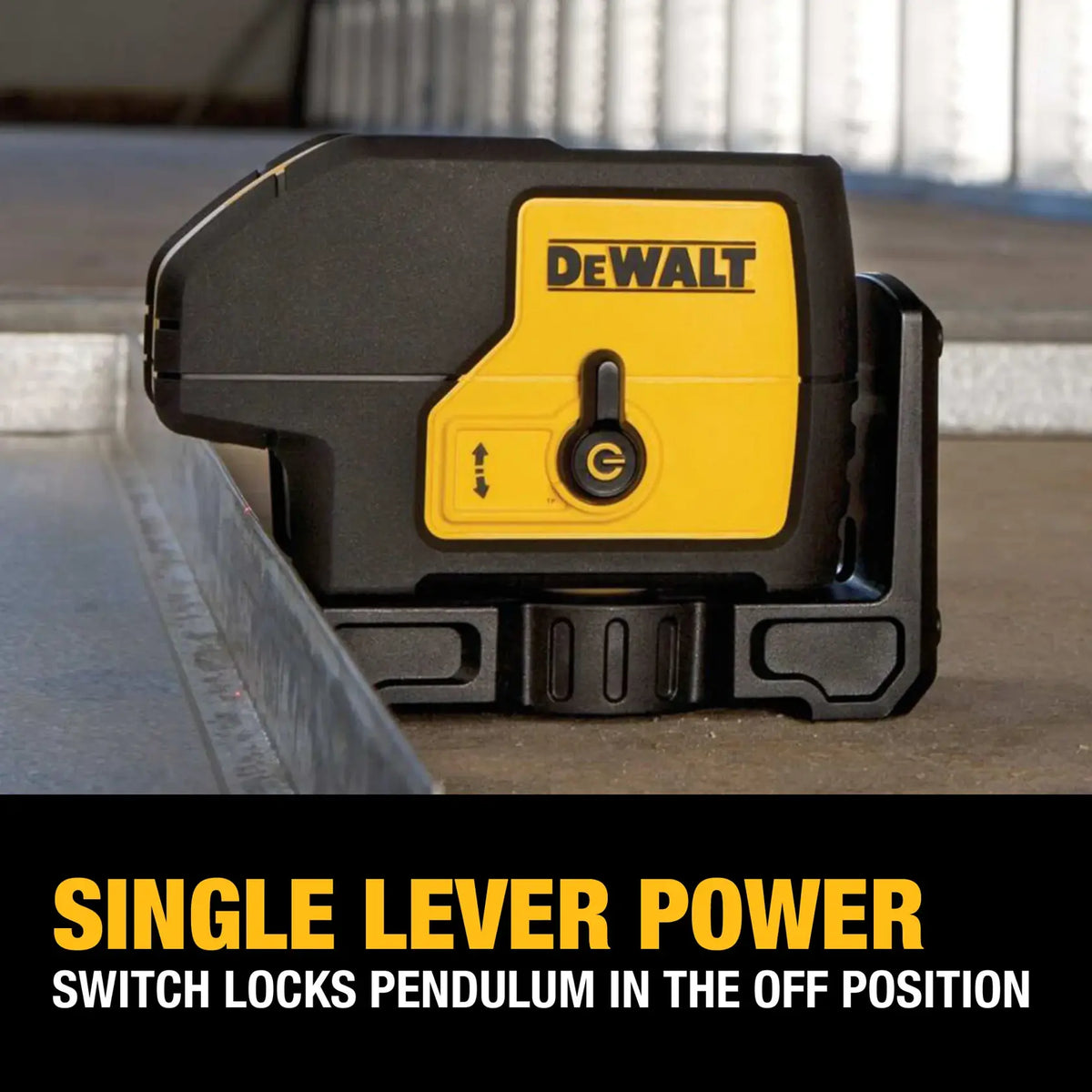 Close-up of the DEWALT DW083K spot laser level showing the single lever power switch in the locked position, which secures the internal pendulum during transport.