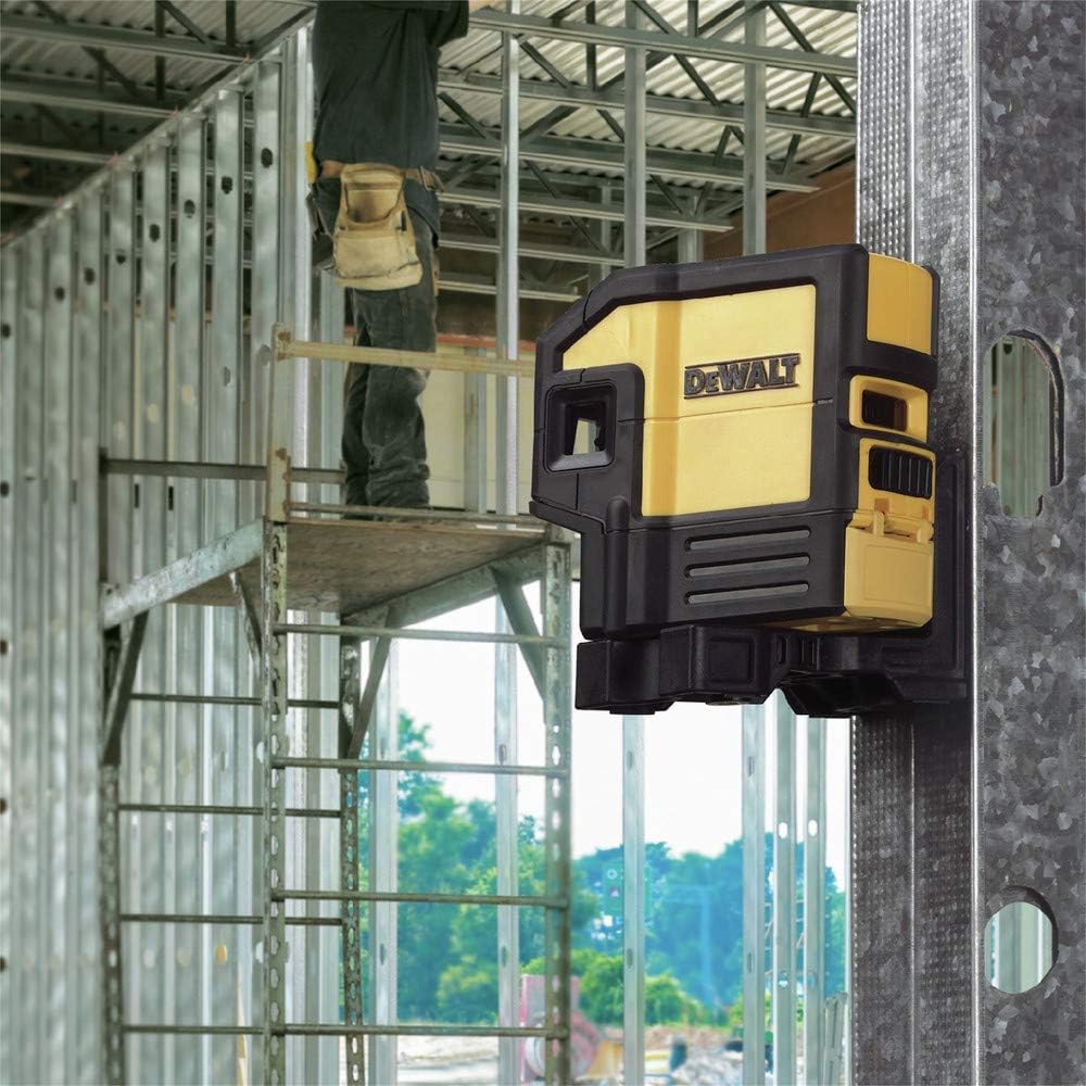 A worker mounting the DEWALT DW0851 laser level to a vertical steel stud using the integrated magnetic pivoting base, illustrating hands-free operation for commercial framing and layout tasks.