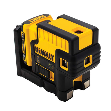 Angled view of the DEWALT green laser layout tool highlighting the powerful magnets on the integrated bracket for secure attachment to steel tracks and metal framing.