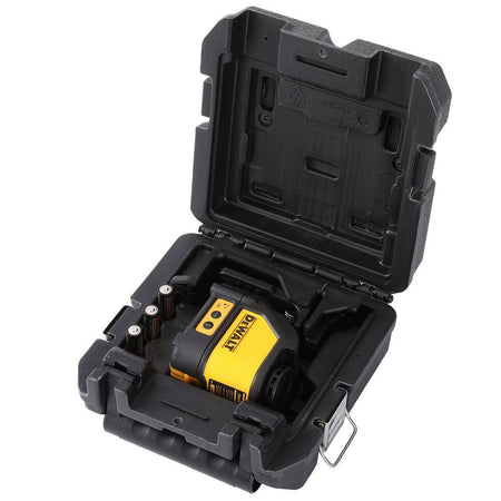 The DEWALT DW088CG green laser level kit organized inside its custom-fit heavy-duty carrying case, including the laser unit and a set of three AA batteries.