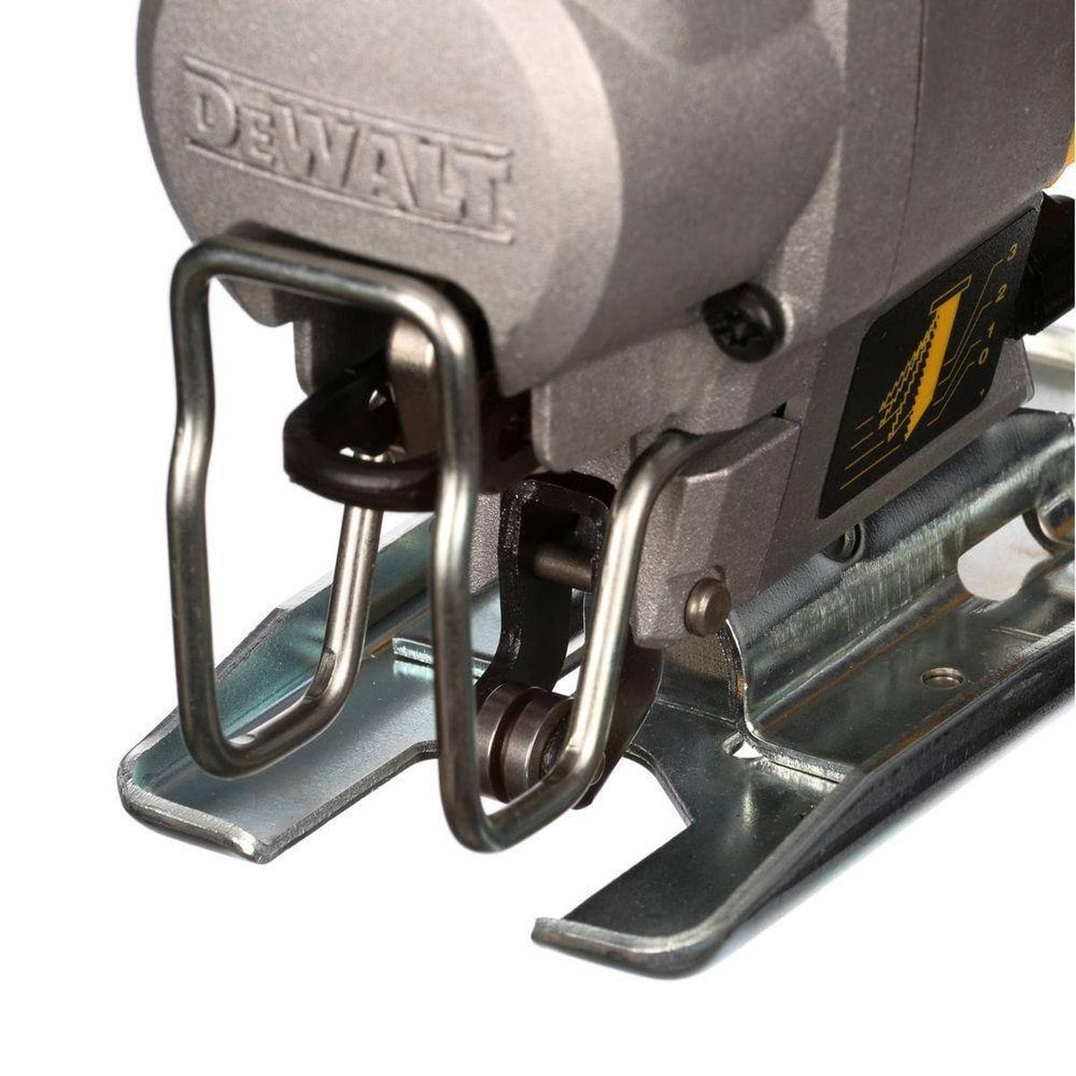 Macro view of the DEWALT jig saw front assembly featuring the keyless lever-action blade clamp and integrated blade guide roller for precision tracking.