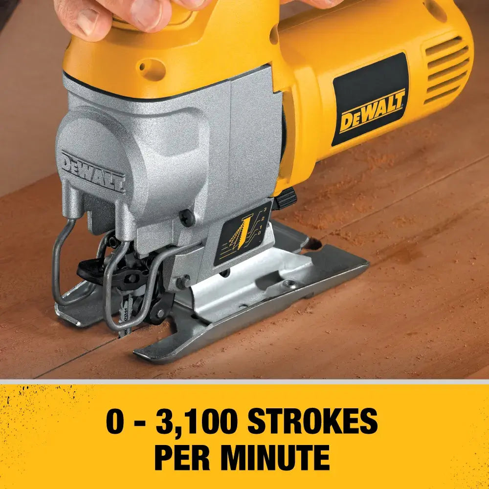 Action shot of the DEWALT 5.5 amp jig saw cutting through a wood board with text overlay indicating a high performance speed of 0 to 3,100 strokes per minute.