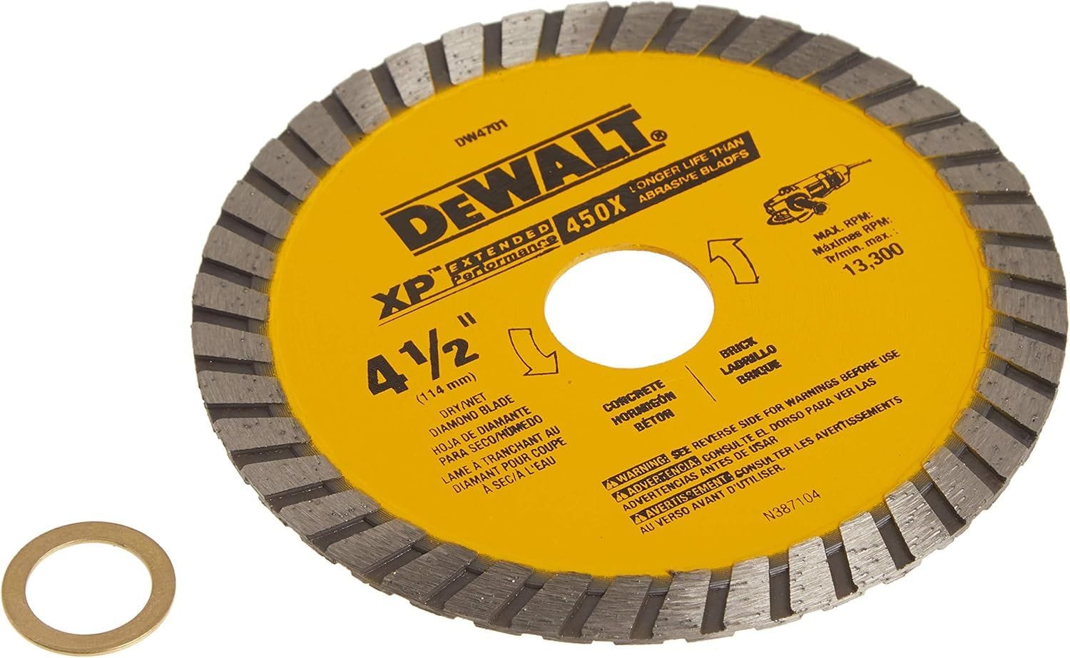Close-up of the DEWALT diamond masonry saw blade with the included 5/8-inch arbor adapter, showcasing the industrial turbo rim designed for wet and dry dewatering and masonry tasks.