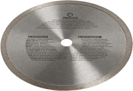 A shot of the reverse side of the DEWALT DW4791 diamond blade. The steel core is printed with detailed safety warnings and operational instructions in multiple languages, emphasizing the requirement for eye and respiratory protection during tile cutting.