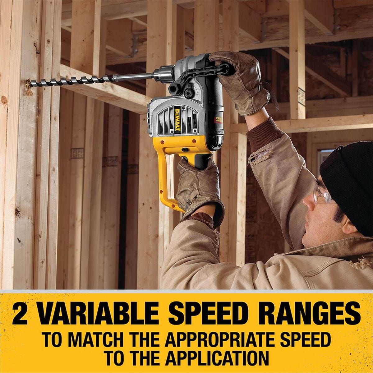 Professional application of the DEWALT right-angle drill boring through a wall stud, illustrating the 2 variable speed ranges that allow the operator to match the appropriate speed to the specific drilling task.