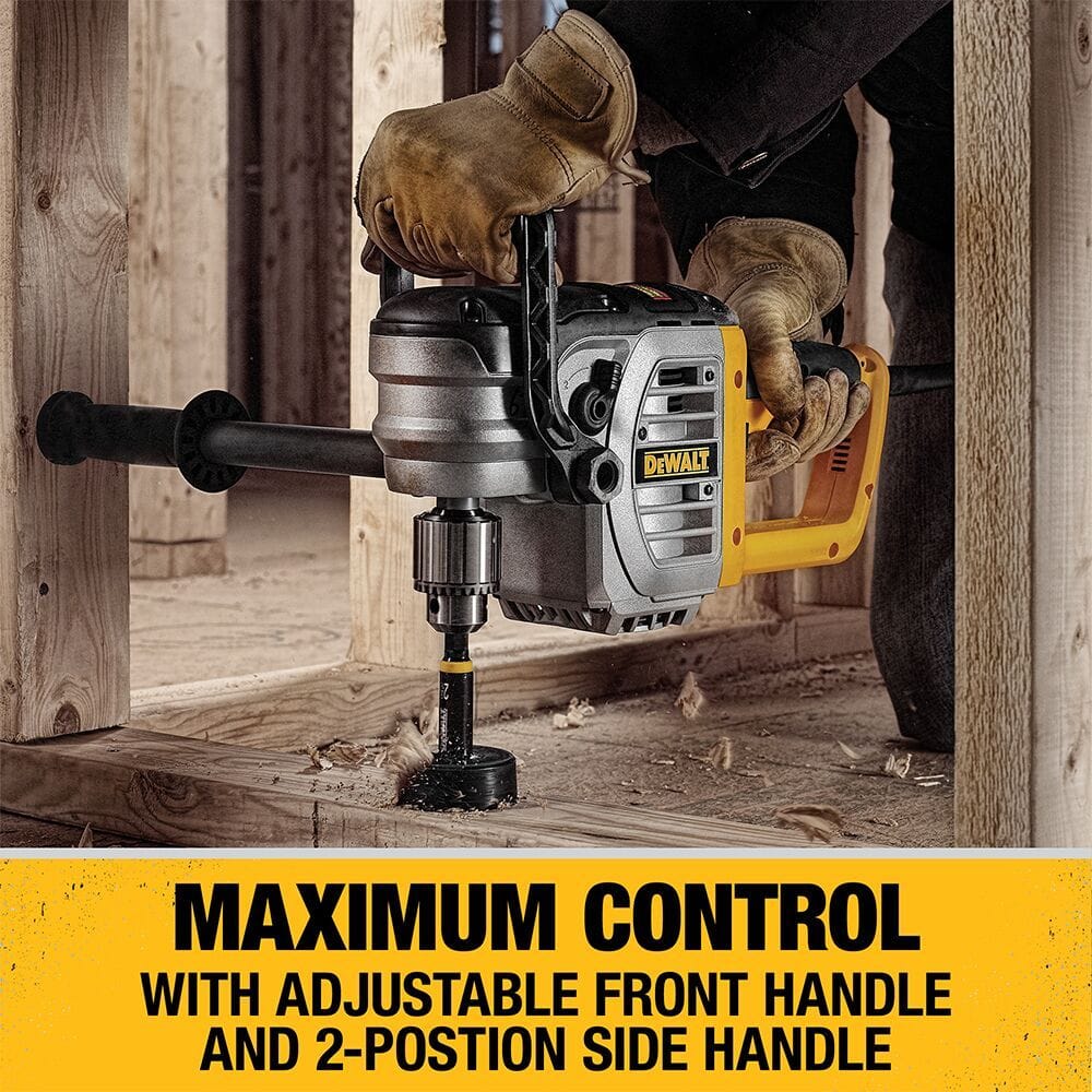 Action shot of a contractor using the DEWALT DWD460 to bore a large diameter hole in floor joists, demonstrating the maximum control provided by the adjustable front handle and ergonomic side grip.