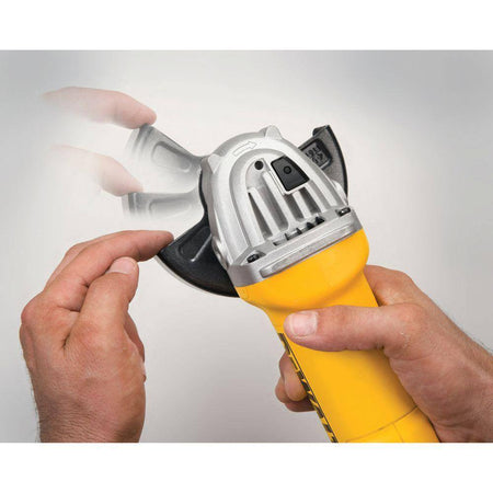A studio demonstration shot of a hand adjusting the DEWALT One-Touch guard. Multiple exposure effects show the guard rotating through different positions, illustrating the 360-degree versatility and ease of use for professional metalworking safety.