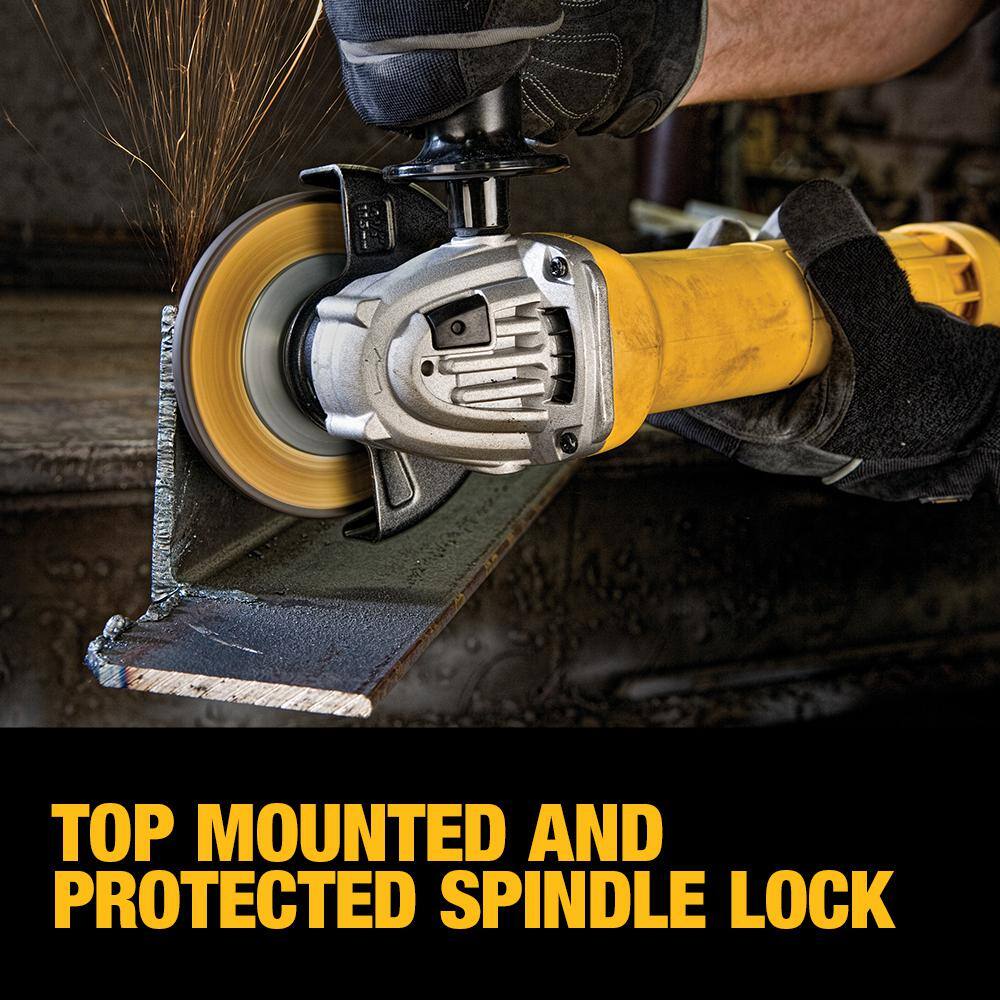 Lifestyle action shot of a professional in protective gear using the DEWALT DWE402 4.5-inch angle grinder to blend a heavy structural steel weld. The image demonstrates the tool's compact size and ergonomic paddle switch control, allowing for precise metal finishing in cramped or awkward angles.