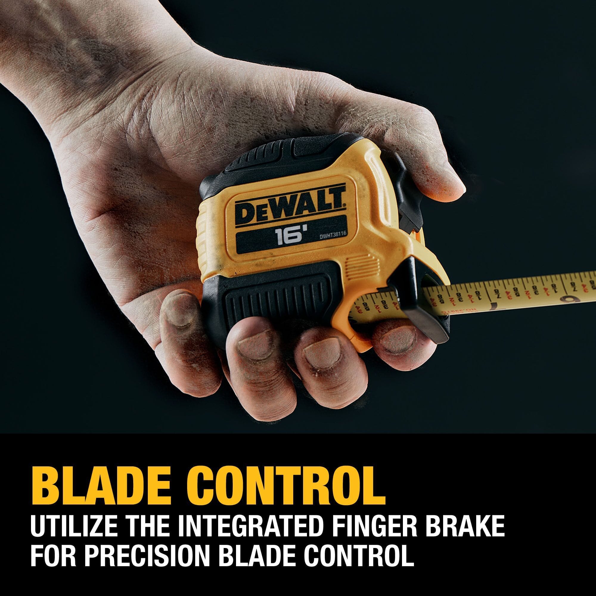 A close-up shot of a worker's hand holding the DEWALT ATOMIC tape measure, demonstrating the use of the integrated finger brake for precise control during blade retraction.