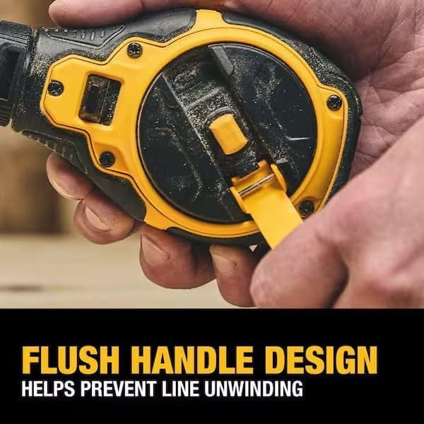 A detailed view of the flush handle design, showing how the yellow rewind handle folds flat into the black housing to prevent accidental line unwinding during transport.
