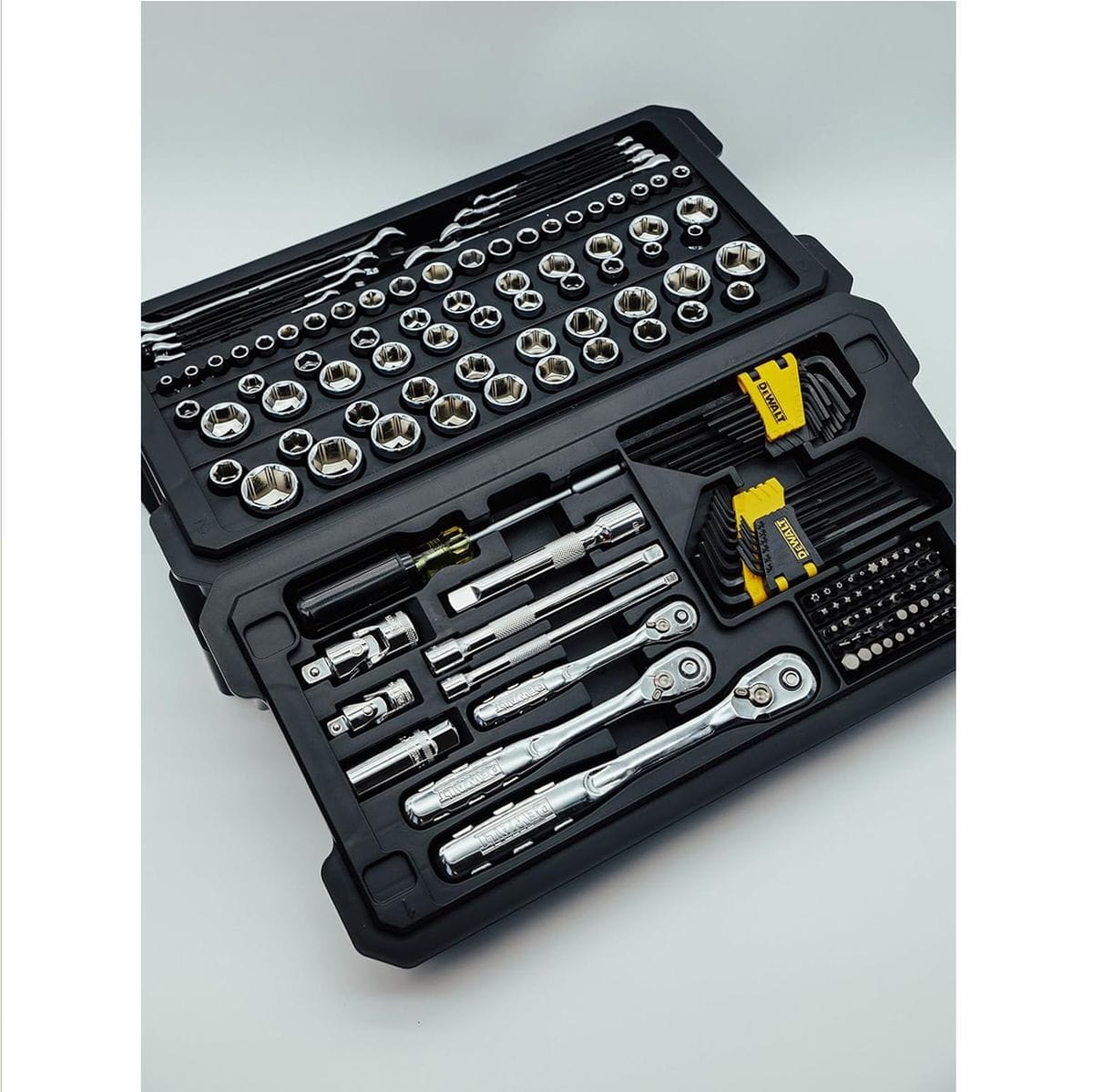 A professional DEWALT 226-piece mechanics tool set organized in durable black high-impact trays, featuring 72-tooth ratchets, full polish chrome sockets, extension bars, and a comprehensive bit driver assortment.