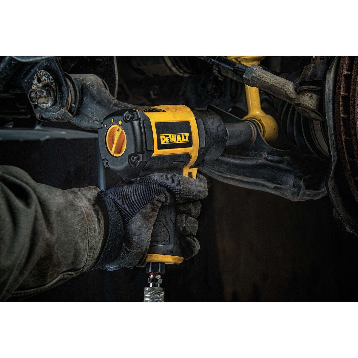 The DEWALT DWMT70773L air impact wrench shown in its original retail packaging, featuring high-visibility branding that lists key specifications like 650 ft-lb of torque and the 3-year limited warranty.