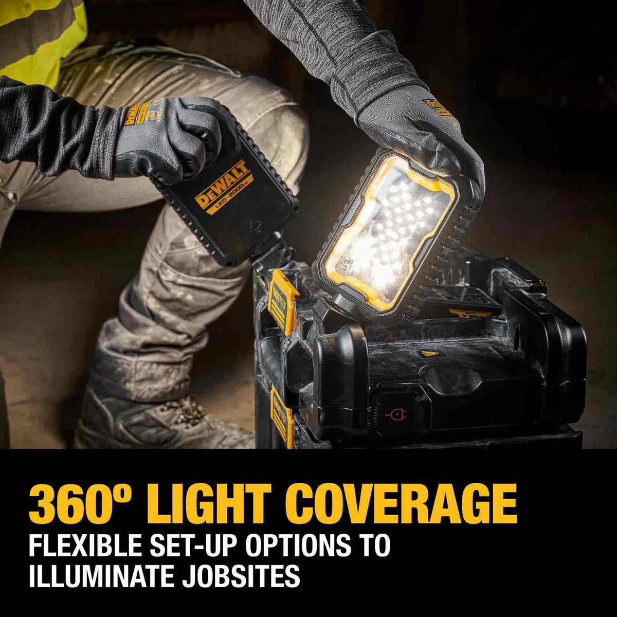 Jobsite application showing a worker adjusting a pivoting LED head on the DEWALT ToughSystem 2.0 light box to achieve 360-degree light coverage in a dim work area.