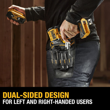 An action lifestyle shot of a worker wearing the DEWALT ambidextrous tool belt pouch. The image features a text overlay stating DUAL-SIDED DESIGN FOR LEFT AND RIGHT-HANDED USERS, illustrating the holster's versatility while holding a drill and various hand tools on the jobsite.