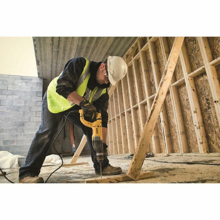 DEWALT SDS+ 1-1/8" Rotary Hammer Drill with Vibration Control drilling wood frame construction site
