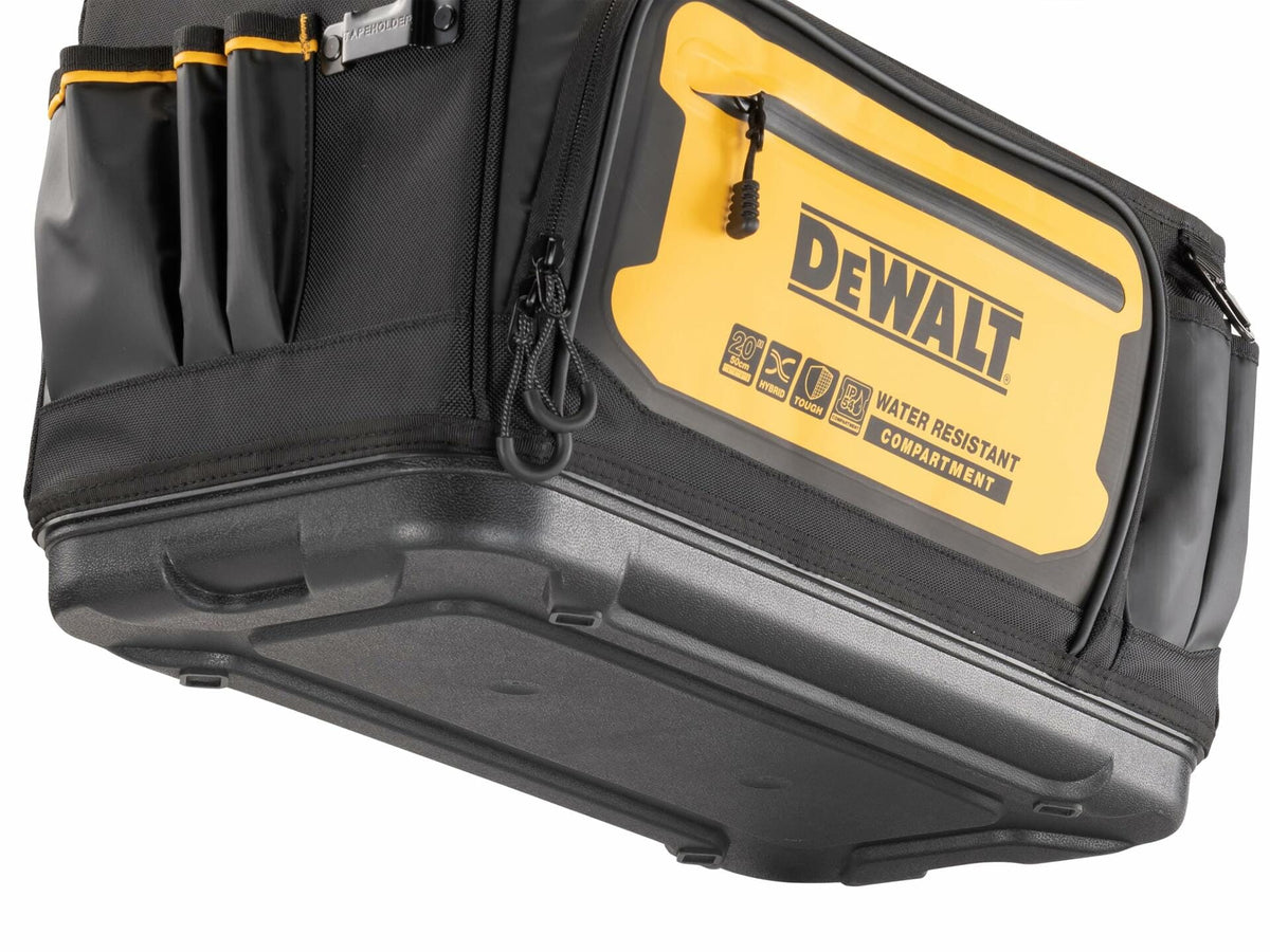 Close-up of the bottom and side of a DEWALT tool tote featuring a molded waterproof base and yellow side panel with “DEWALT WATER RESISTANT COMPARTMENT” branding. Multiple compartments and icons highlight the tote’s durability and functionality.