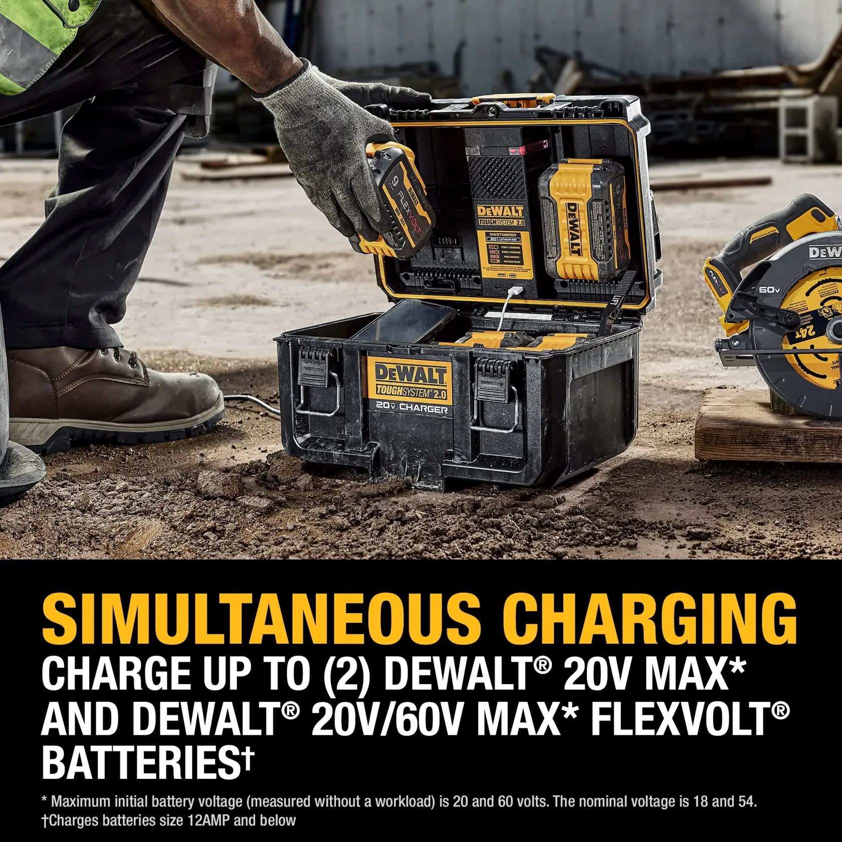 An action lifestyle shot of a professional worker inserting a FLEXVOLT battery into the DEWALT ToughSystem charger box on a dusty construction site. The image demonstrates the simultaneous charging capability and the industrial durability of the IP55-rated housing.