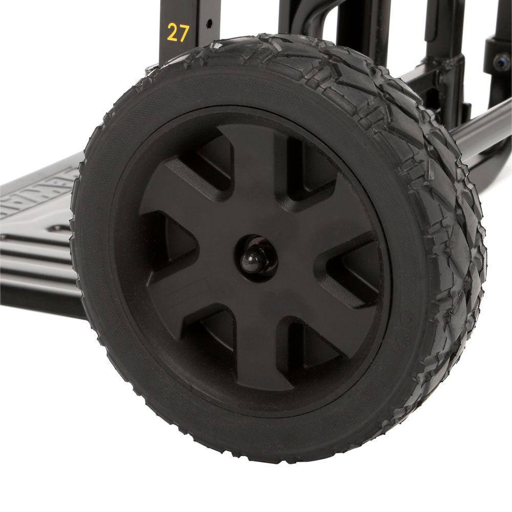 A close-up view of the large all-terrain wheel on the DEWALT modular carrier. The deep tread pattern is designed for maximum traction and durability when moving heavy tool stacks over gravel, mud, and uneven construction surfaces.