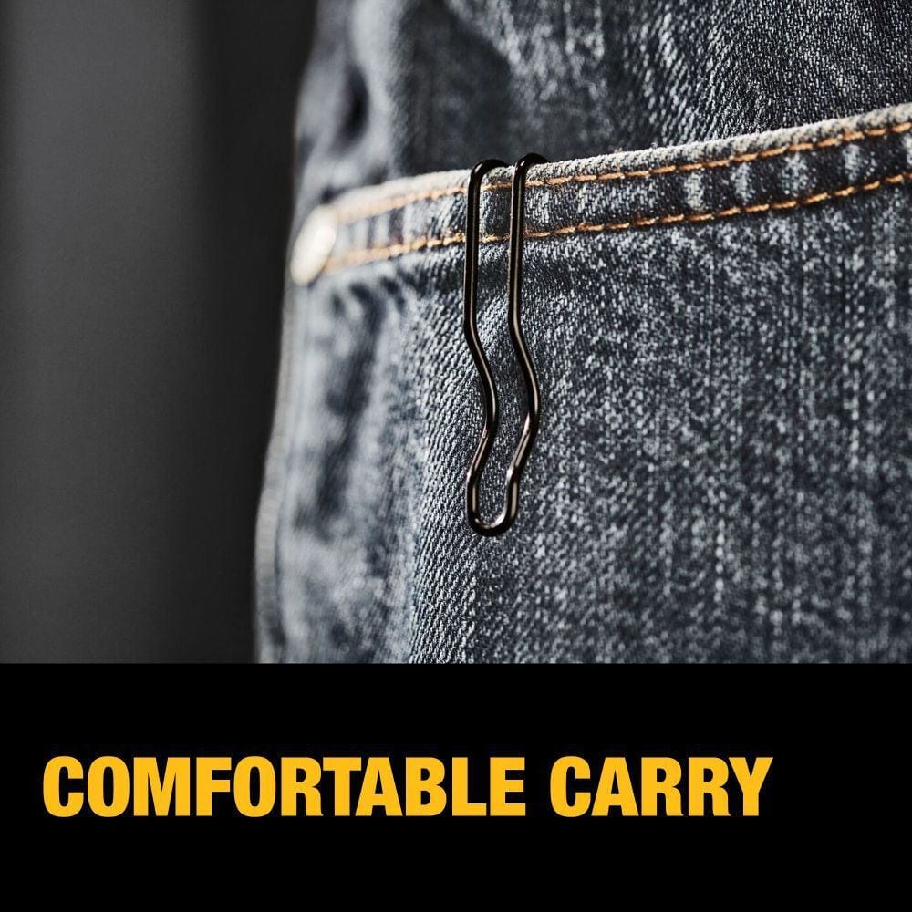 Close-up of denim jeans pocket with metallic clip attached, illustrating comfortable carry feature for pocket knives or small tools.