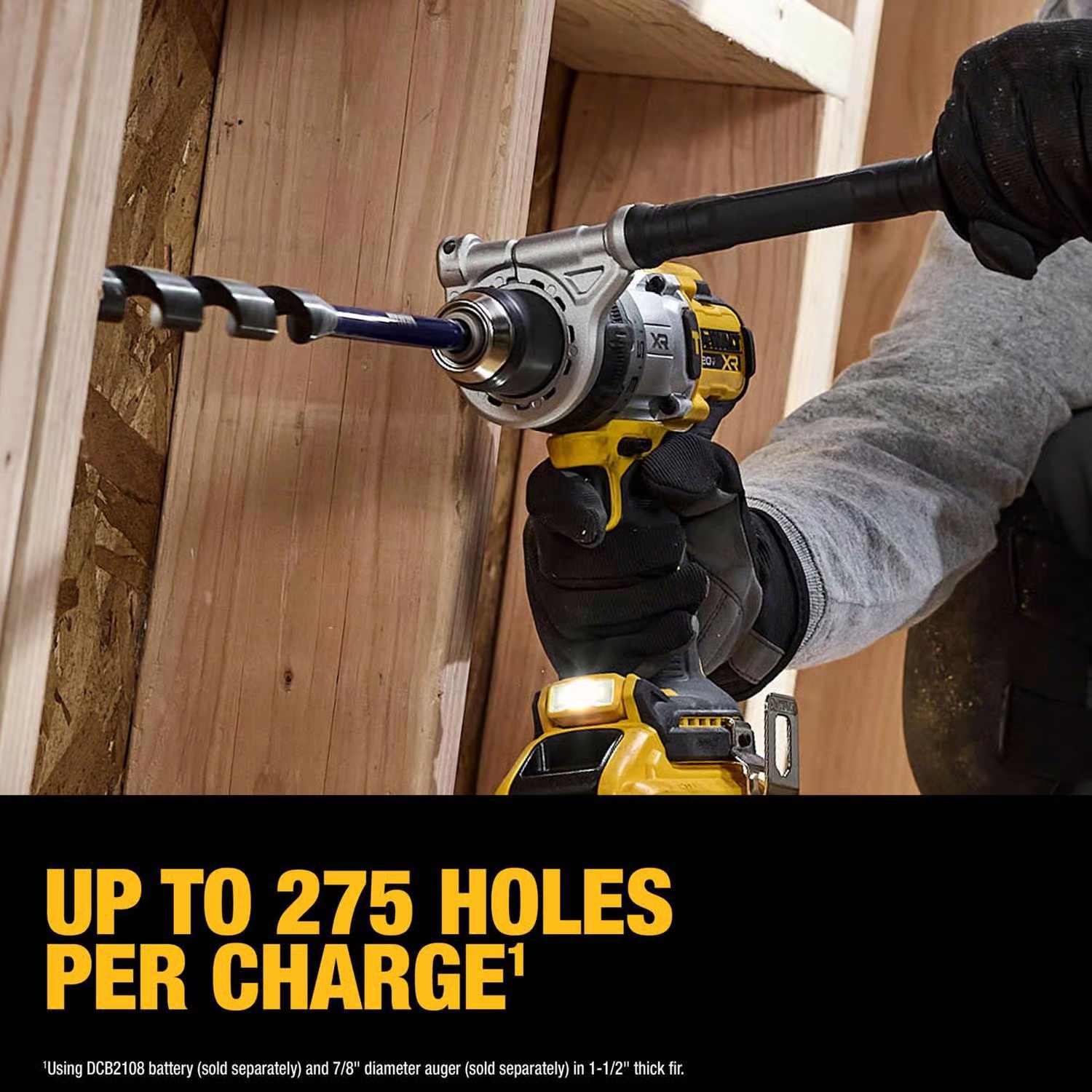 DeWalt 20V MAX XR Brushless Hammer Drill with large auger bit drilling wood studs for heavy-duty construction use