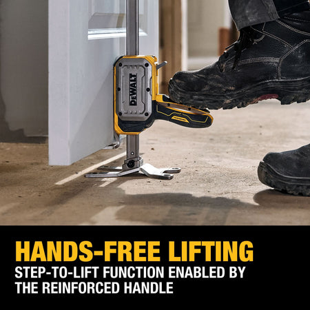 Operator using boot to press DeWalt DWHT83550 step-to-lift foot pedal handle, enabling hands-free vertical door alignment.