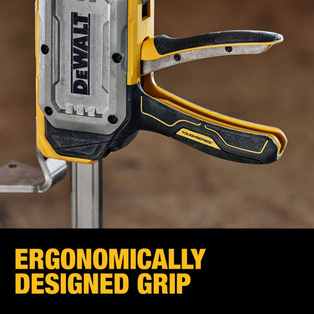 Close-up view of DeWalt ToughSeries ergonomic trigger handle with metal reinforcing ribs for comfortable high-load pumping.