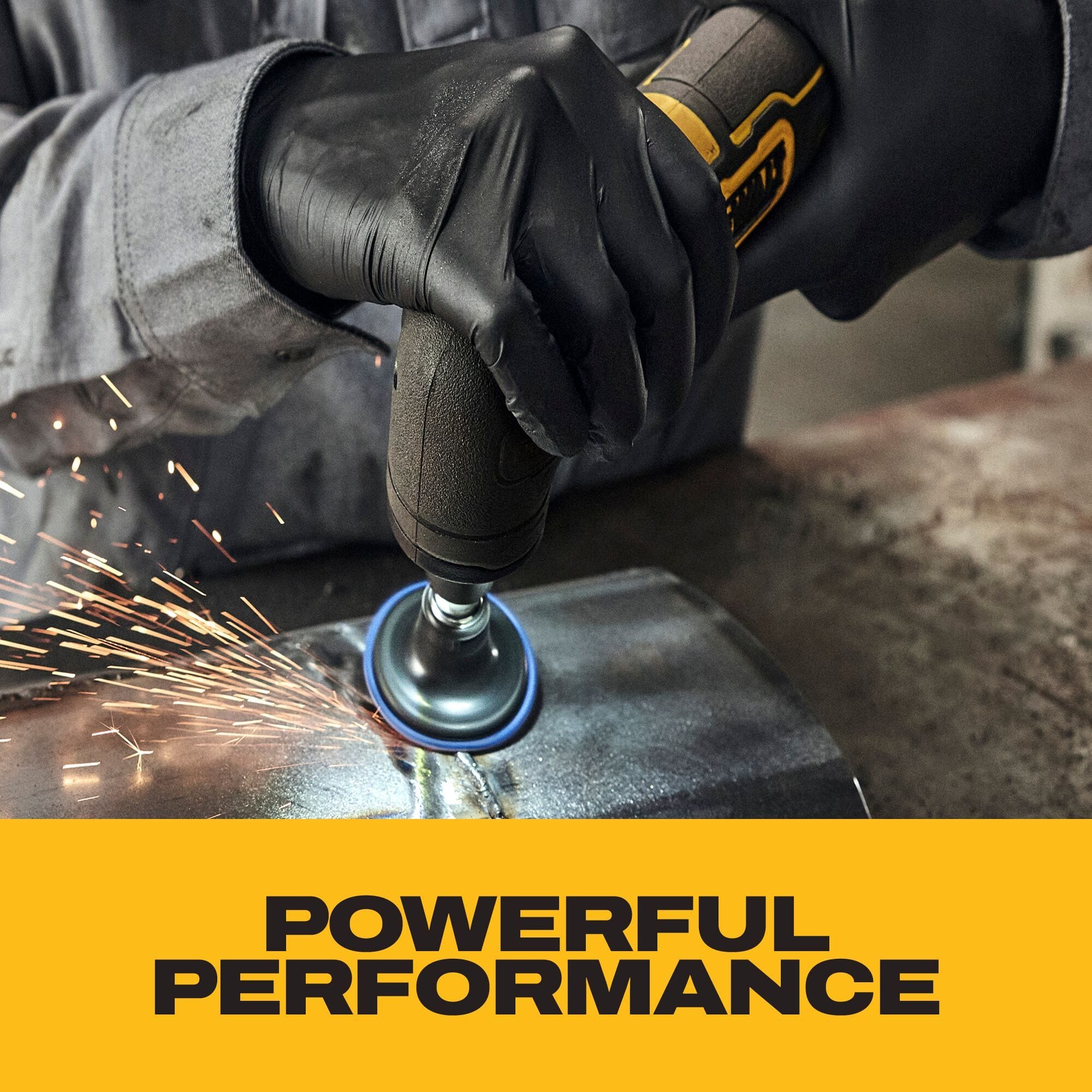 Close-up action view showing a metal fabricator wearing a gray long-sleeve shirt and black nitrile gloves manipulating the DeWalt 20V MAX cordless right angle die grinder to blend a steel sheet seam with a sanding wheel accessory, generating sparks, over a gold block with text emphasizing powerful performance