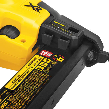 A close-up studio shot of the tool-free depth adjustment dial on the DeWalt DCN681 stapler.