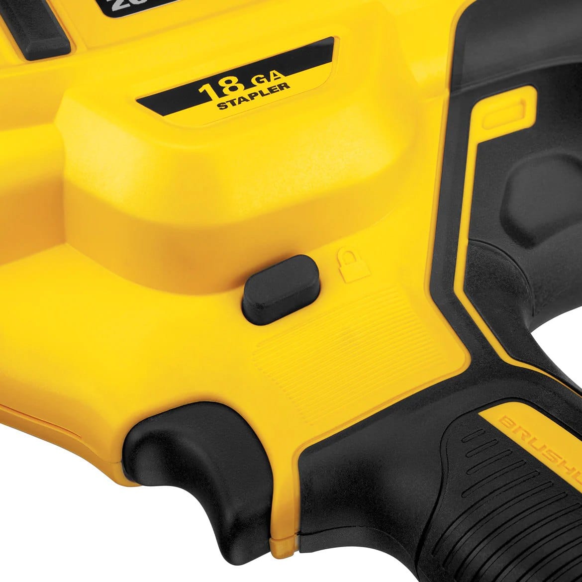A close-up studio shot of the selectable trigger switch and "18 GA Stapler" logo on the side of the DeWalt DCN681.