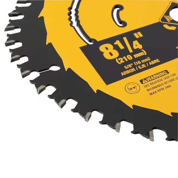 Extreme close-up of the saw blade rim showing the sharp tungsten carbide teeth, reinforced shoulders, and the black anti-stick coating contrasting with the yellow blade body.