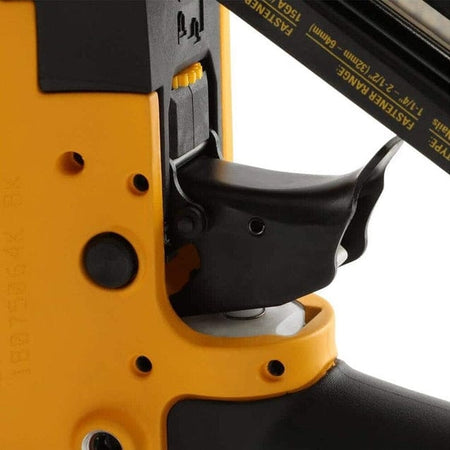 A close-up studio shot of the trigger and selectable trigger switch on the DeWalt DWFP72155 finish nailer.