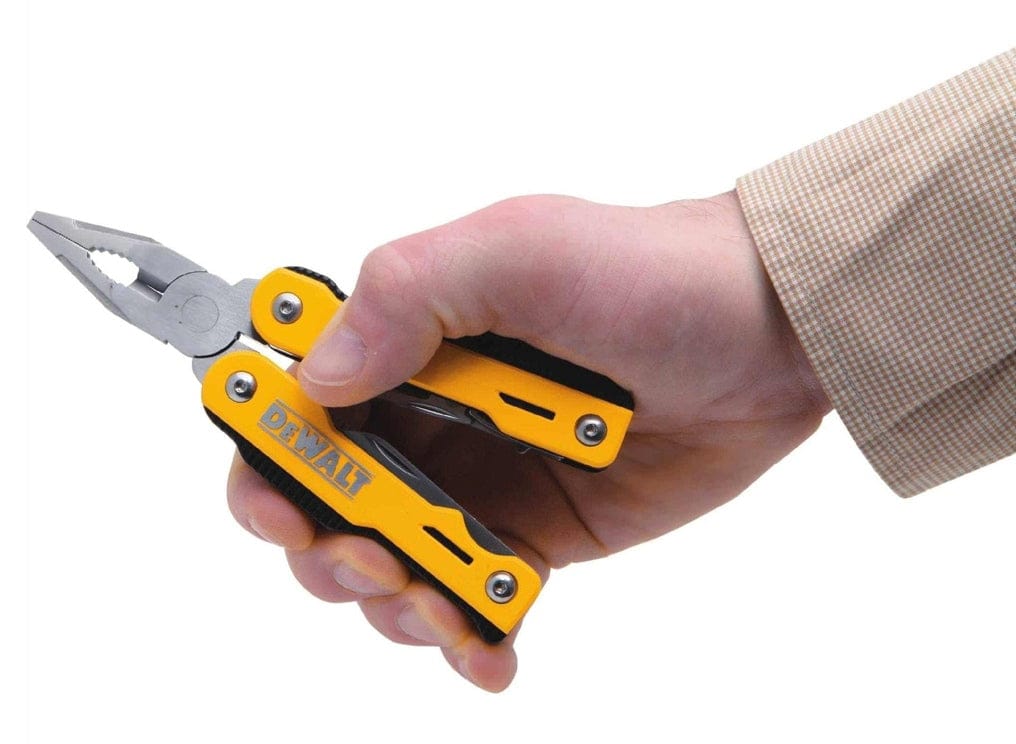 A hand gripping the open DeWalt multi-tool, demonstrating the ergonomic fit and the use of the spring-loaded pliers in a practical setting.
