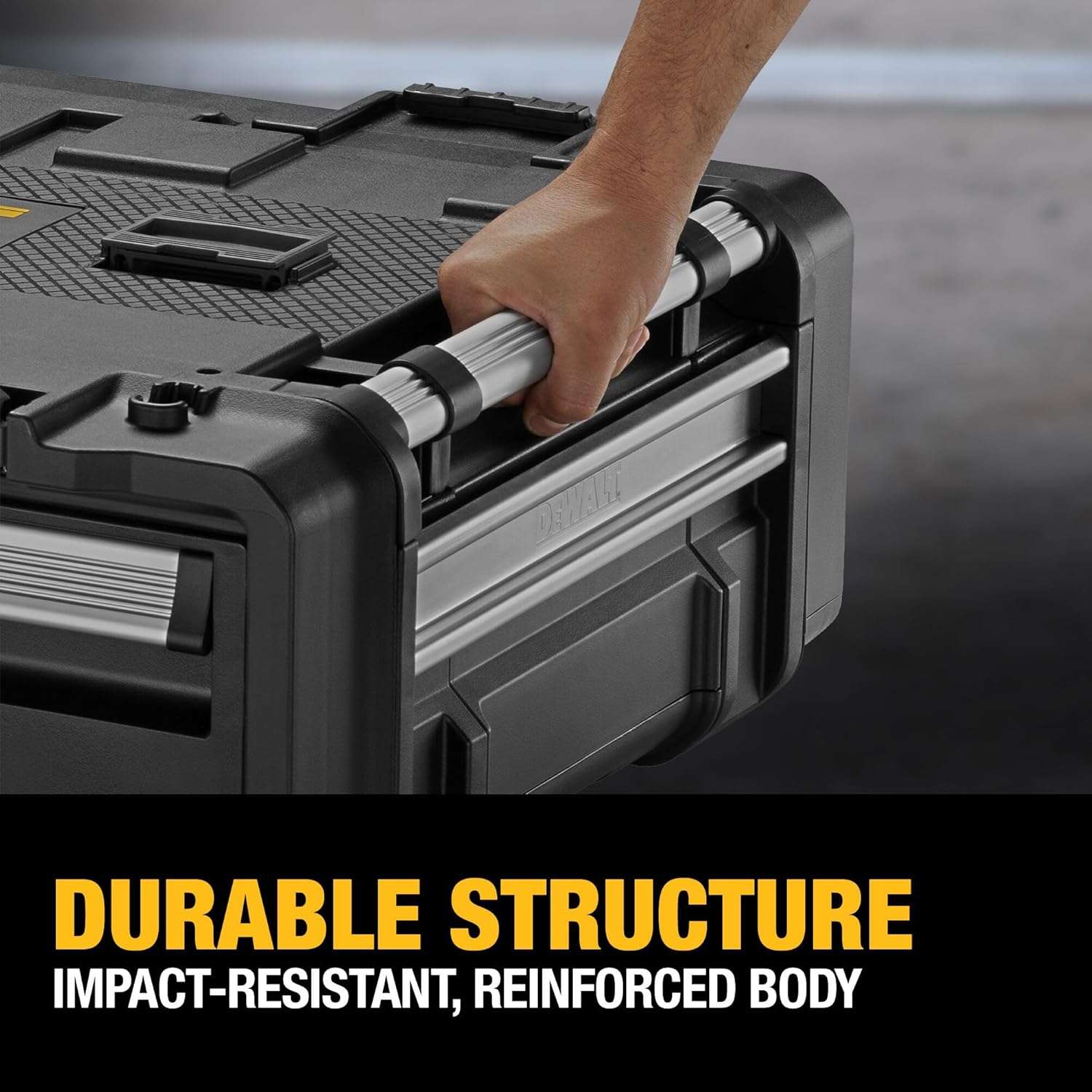Close-up detail of a hand gripping the durable aluminum carry handle on the side of the unit, captioned Durable Structure Impact-Resistant, Reinforced Body.