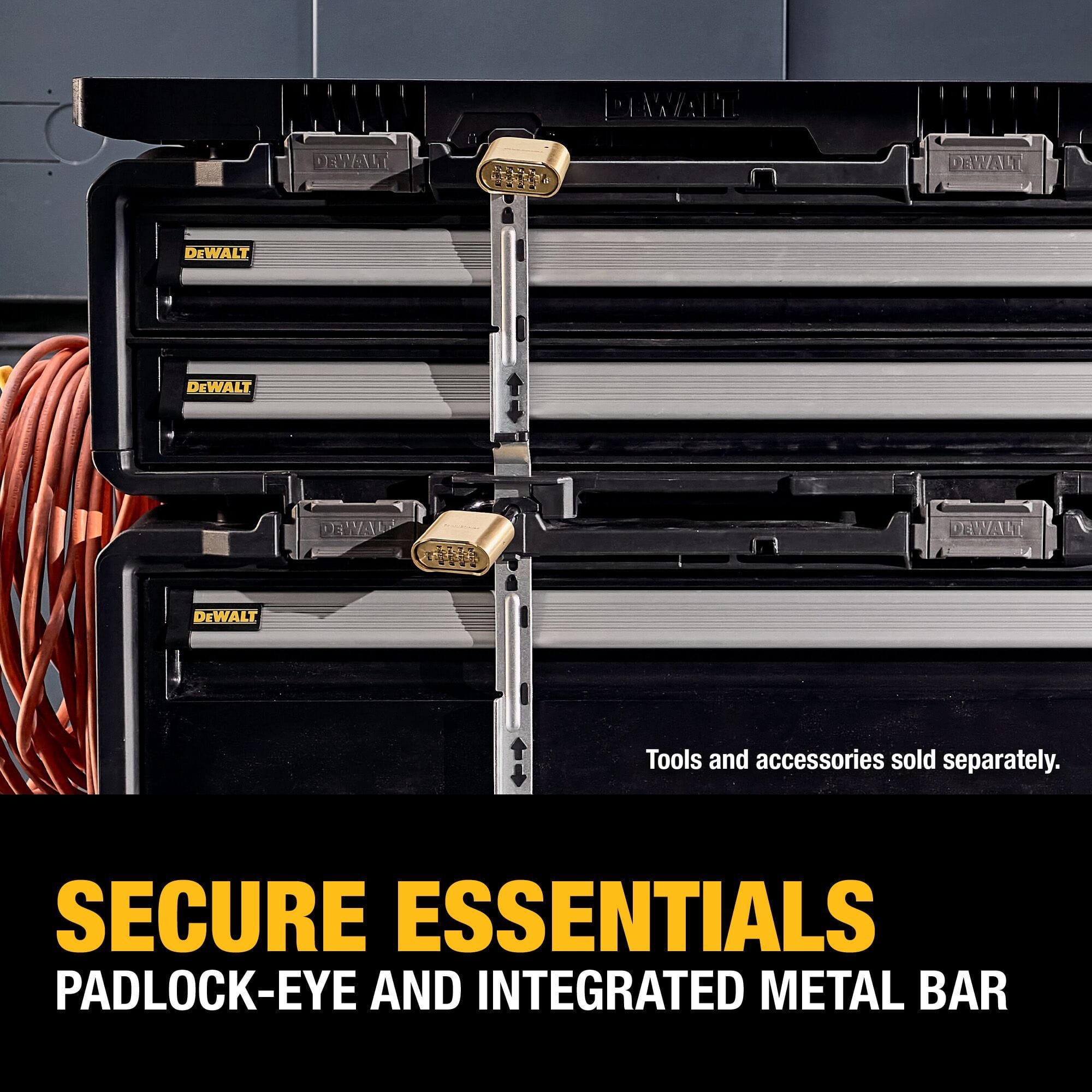 A close-up application graphic demonstrating the locking security of stacked DEWALT tool boxes, showing a central vertical metal locking bar running down the front faces with brass combination padlocks clicked into the top and center padlock-eyes, with lower white text reading SECURE ESSENTIALS PADLOCK-EYE AND INTEGRATED METAL BAR.