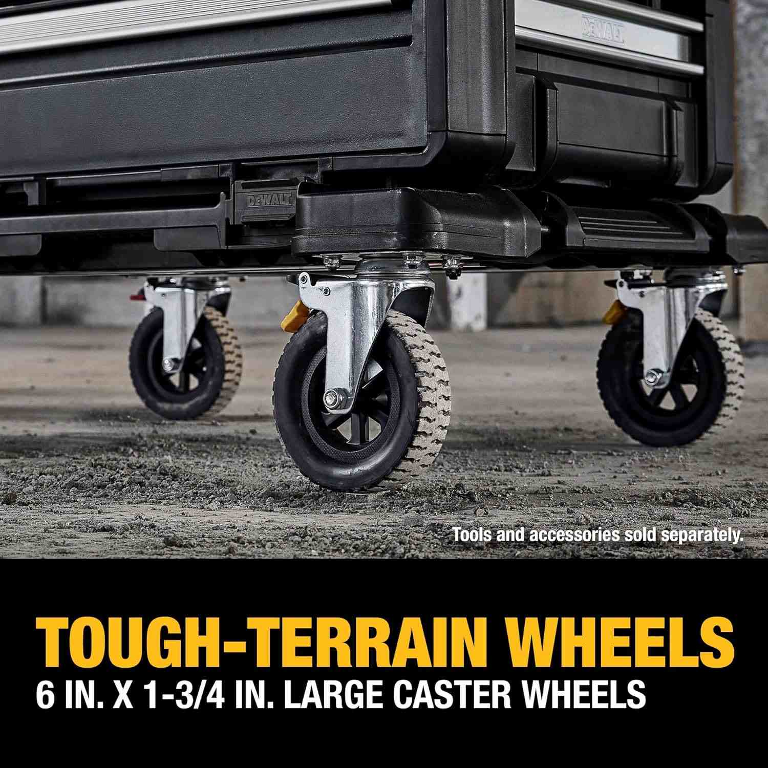 Close-up view of the dolly's large caster wheels rolling over rough concrete debris, captioned Tough-Terrain Wheels 6 inch by 1-3/4 inch large caster wheels.
