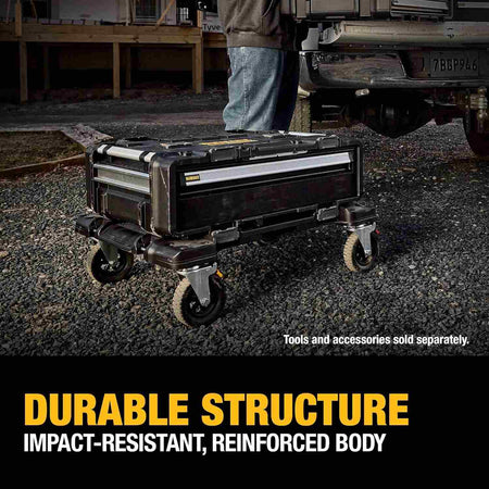 Outdoor shot of the dolly supporting a single drawer unit on a gravel surface near a work truck, captioned Durable Structure Impact-Resistant, Reinforced Body.