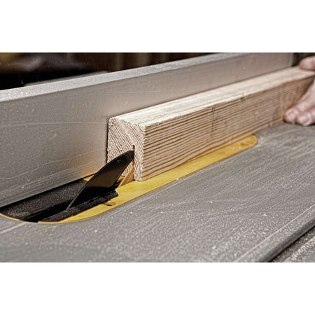 Making a dado groove pass on a wood post using a dado blade set on the DeWalt DWE7491RS table saw.